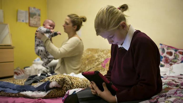 A mother holding her child, single mothers will be hit by the benefit cap