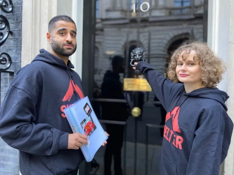 Two campaigners outside no 10 Downing Street
