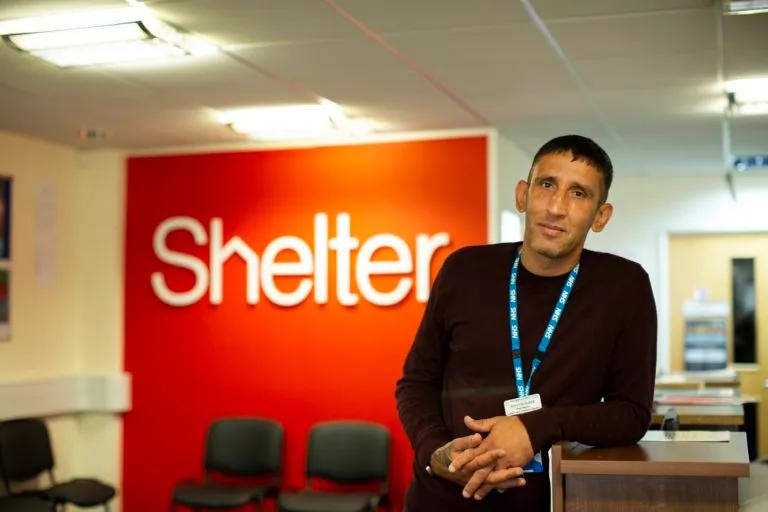 Paddy Burke, Shelter Peer Mentor, looking into the camera in the Shelter office 