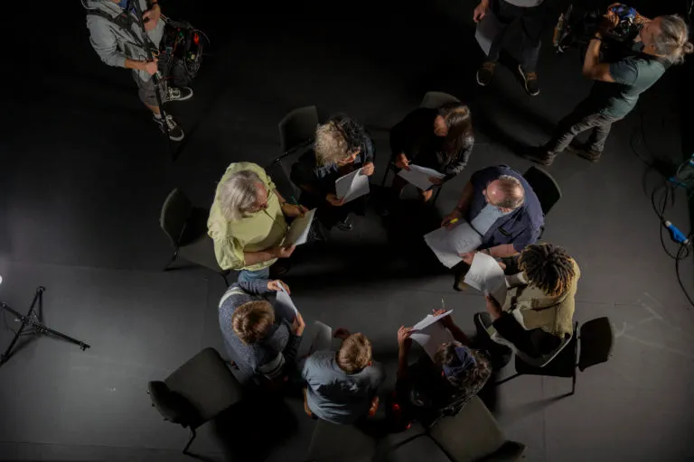 A group of people sitting in a circle